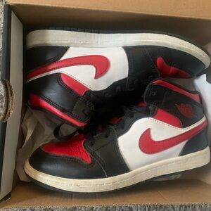 Boys size 2 Jordan 1 MID  red /black and white inside original box.